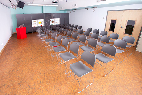A room in the ArtStarts office with chairs set up in several rows.