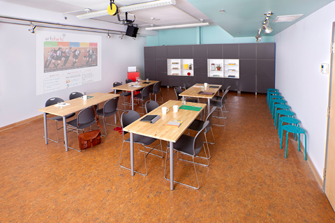 A room in the ArtStarts office with desks and chairs set up. 